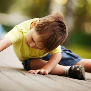 Boy playing with toy car